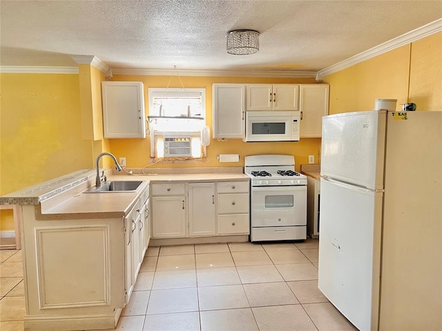 607 E Liveoak St, Altus, OK 73521 - kitchen featuring white appliances, ornamental molding, light countertops, light tile patterned floors, and a textured ceiling