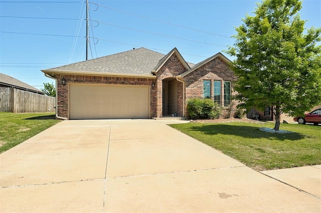 15808 Cantera Creek Dr, Edmond, OK 73013 - ranch-style house featuring fence, a front yard, brick siding, and a garage