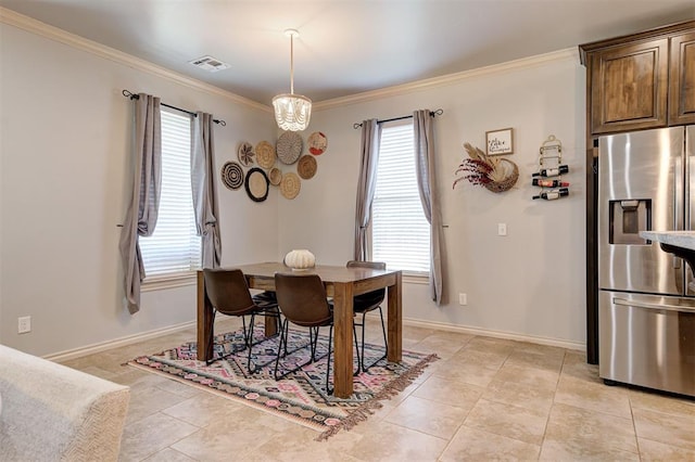 15808 Cantera Creek Dr, Edmond, OK 73013 - dining area with light tile patterned floors, visible vents, crown molding, and baseboards