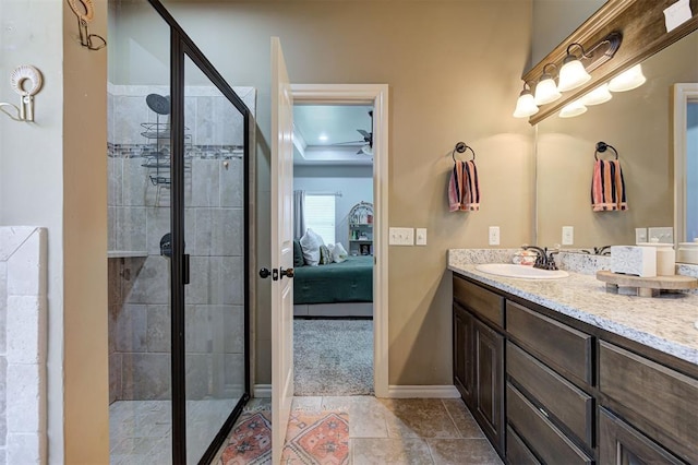 15808 Cantera Creek Dr, Edmond, OK 73013 - bathroom with a shower stall, vanity, ceiling fan, ensuite bath, and baseboards