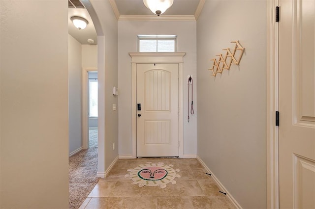 15808 Cantera Creek Dr, Edmond, OK 73013 - doorway to outside featuring light colored carpet, baseboards, crown molding, and arched walkways