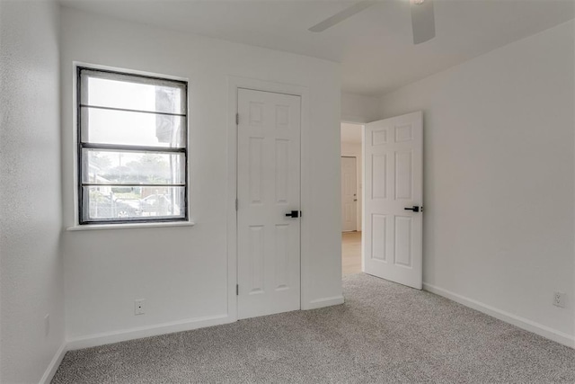 1437 SW 34th St, Oklahoma City, OK 73119 - unfurnished bedroom featuring baseboards, carpet, and ceiling fan