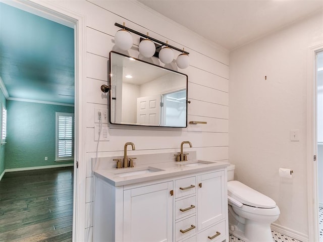 12112 Blue Sage Rd, Oklahoma City, OK 73120 - full bath with crown molding, toilet, baseboards, and a sink