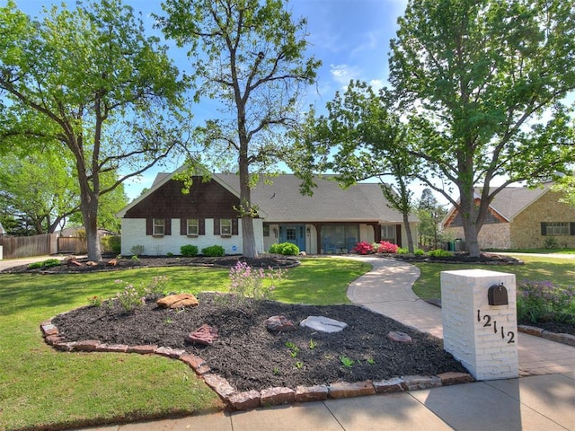 12112 Blue Sage Rd, Oklahoma City, OK 73120 - ranch-style house featuring fence and a front lawn