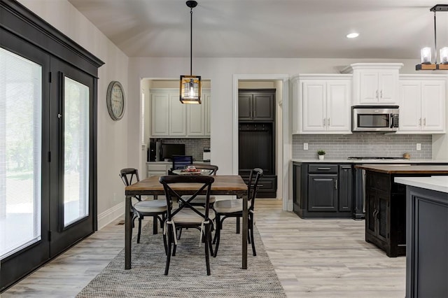 2051 Vaquero Ct, Edmond, OK 73034 - dining space featuring recessed lighting, light wood-style floors, and baseboards
