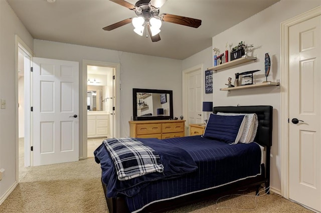 2051 Vaquero Ct, Edmond, OK 73034 - bedroom with ensuite bath, carpet floors, and a ceiling fan