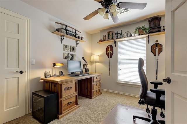 2051 Vaquero Ct, Edmond, OK 73034 - home office with light colored carpet, ceiling fan, baseboards, and visible vents