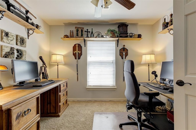 2051 Vaquero Ct, Edmond, OK 73034 - office area featuring light carpet, a ceiling fan, and baseboards