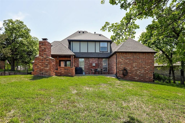 2051 Vaquero Ct, Edmond, OK 73034 - rear view of house featuring a chimney, fence, and a yard