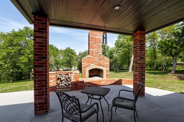 2051 Vaquero Ct, Edmond, OK 73034 - view of patio / terrace featuring an outdoor brick fireplace