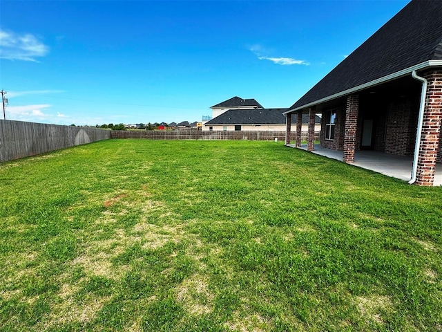 view of yard featuring a fenced backyard and a patio area