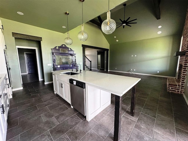 kitchen featuring dishwasher, a sink, decorative light fixtures, lofted ceiling with beams, and white cabinetry