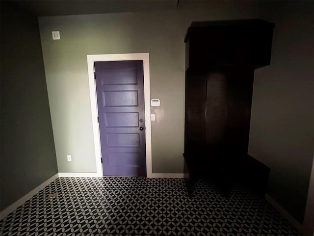 interior space featuring baseboards