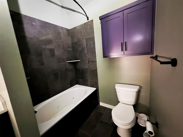 full bath featuring baseboards, shower / bath combination, tile patterned flooring, and toilet