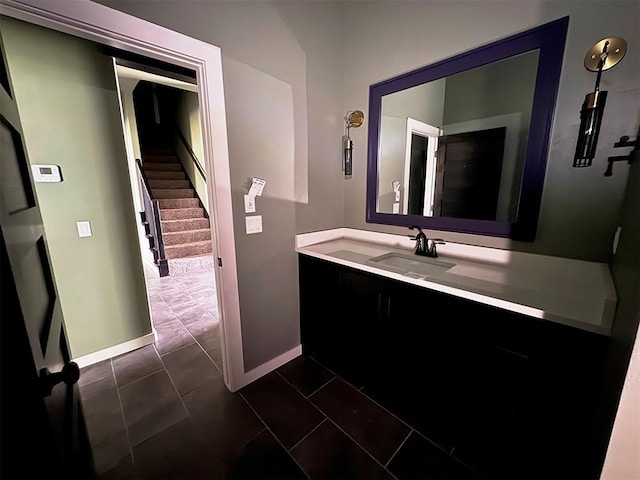 bathroom with baseboards and vanity