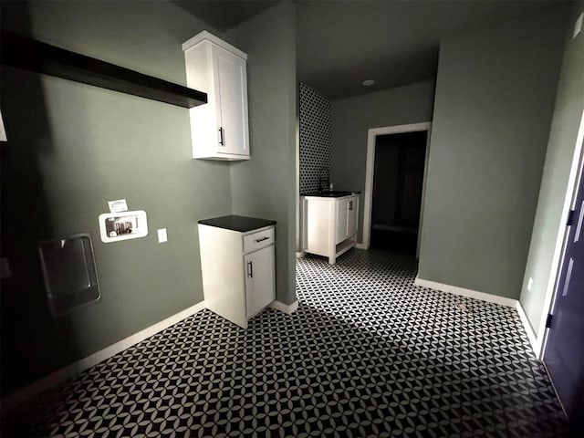 laundry room featuring hookup for a washing machine, baseboards, and laundry area