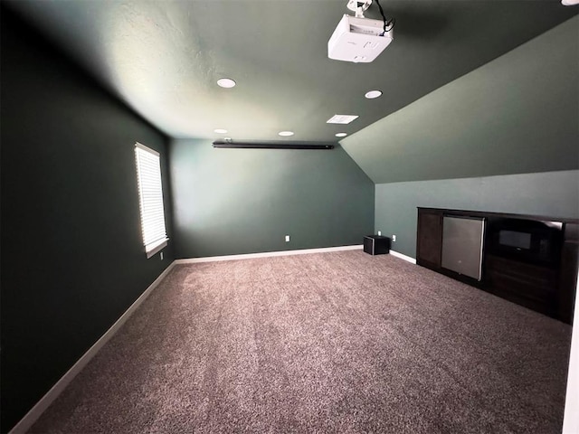 bonus room featuring recessed lighting, vaulted ceiling, carpet floors, and baseboards