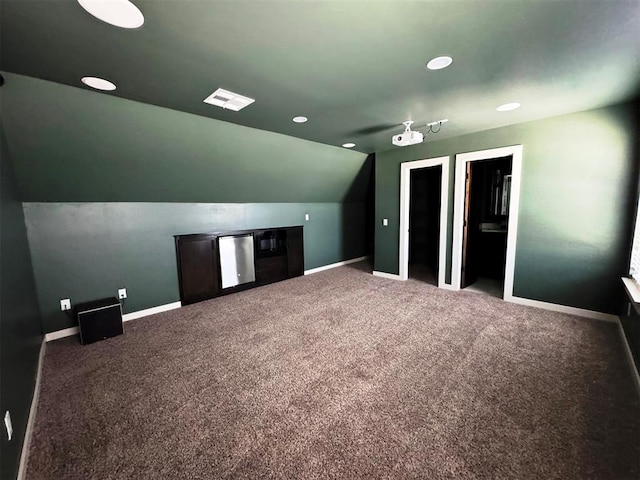 bonus room with baseboards, vaulted ceiling, visible vents, and carpet floors