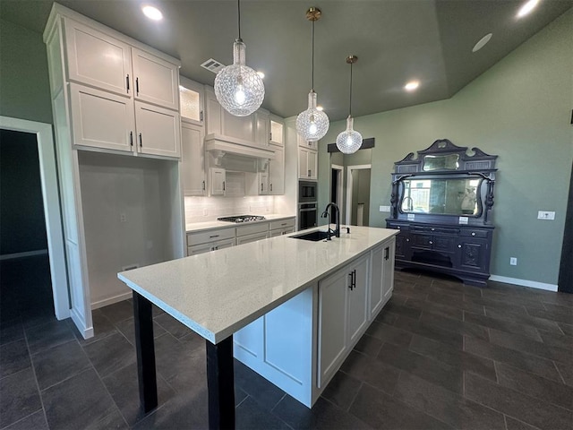 4140 Peony Cir, Piedmont, OK 73078 - kitchen featuring white cabinets, decorative backsplash, stainless steel appliances, recessed lighting, and an island with sink