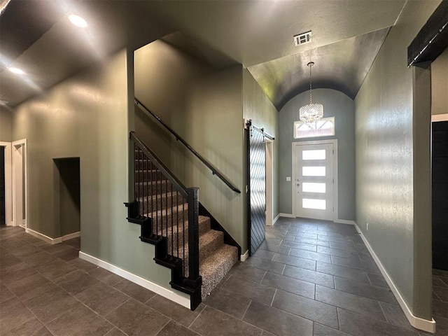 4140 Peony Cir, Piedmont, OK 73078 - foyer entrance featuring vaulted ceiling, stairs, a chandelier, and dark tile patterned flooring