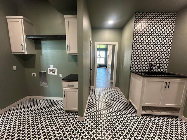 4140 Peony Cir, Piedmont, OK 73078 - laundry room featuring electric dryer hookup, hookup for a washing machine, and cabinet space