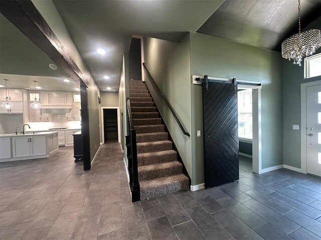4140 Peony Cir, Piedmont, OK 73078 - stairs with a barn door, a chandelier, and recessed lighting