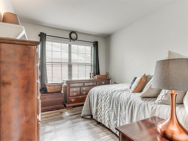 bedroom featuring wood finished floors