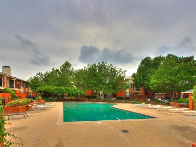 pool with a patio area