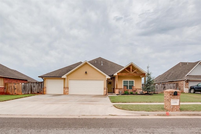 11200 SW 32nd St, Yukon, OK 73099 - craftsman-style home featuring an attached garage, concrete driveway, and roof with shingles
