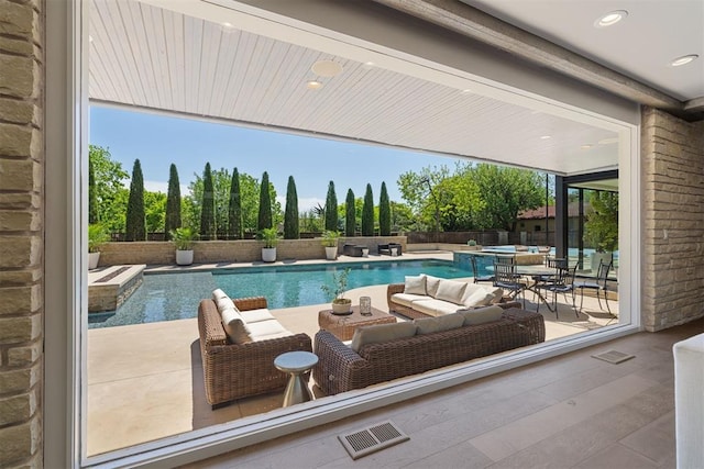 view of pool featuring a pool with connected hot tub