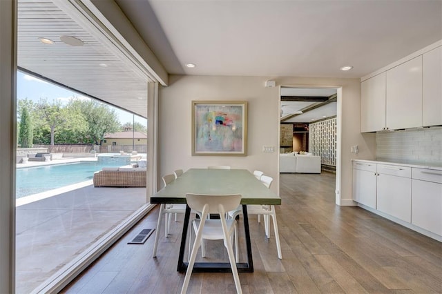 dining area featuring light wood-type flooring, recessed lighting, and visible vents