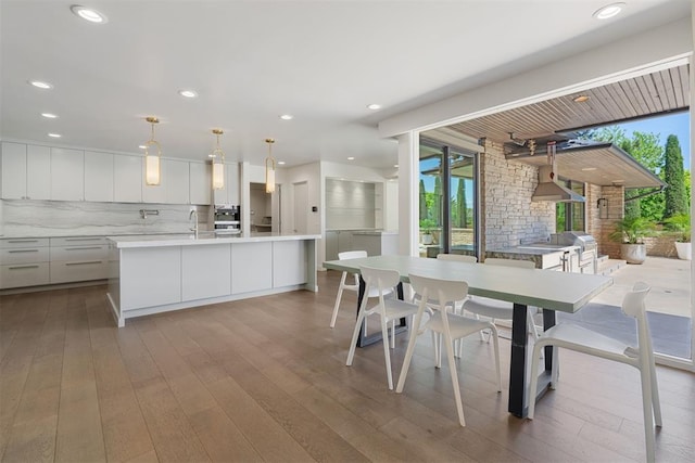 dining room featuring recessed lighting and hardwood / wood-style flooring