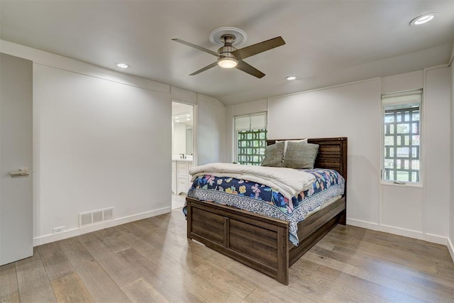 bedroom with recessed lighting, visible vents, and wood finished floors
