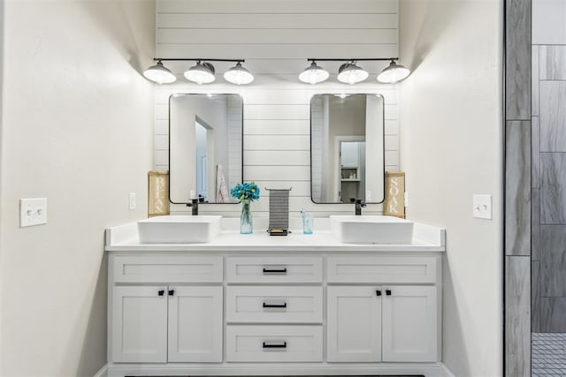 full bath with a sink and double vanity