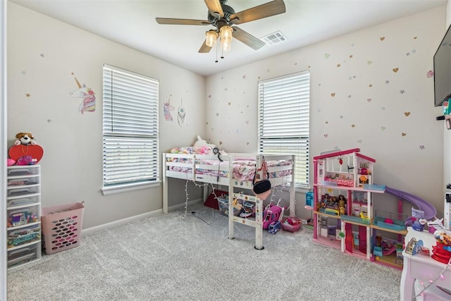 bedroom featuring baseboards, ceiling fan, carpet flooring, and visible vents