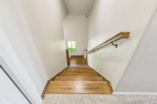 stairs featuring baseboards