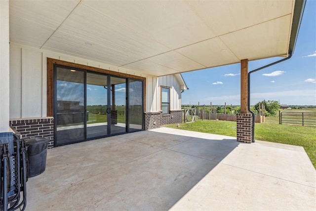 view of patio / terrace featuring fence