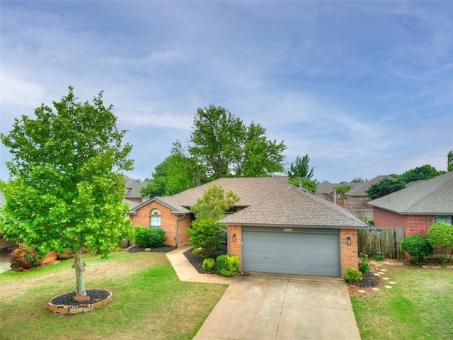 single story home featuring brick siding, fence, a front lawn, concrete driveway, and an attached garage