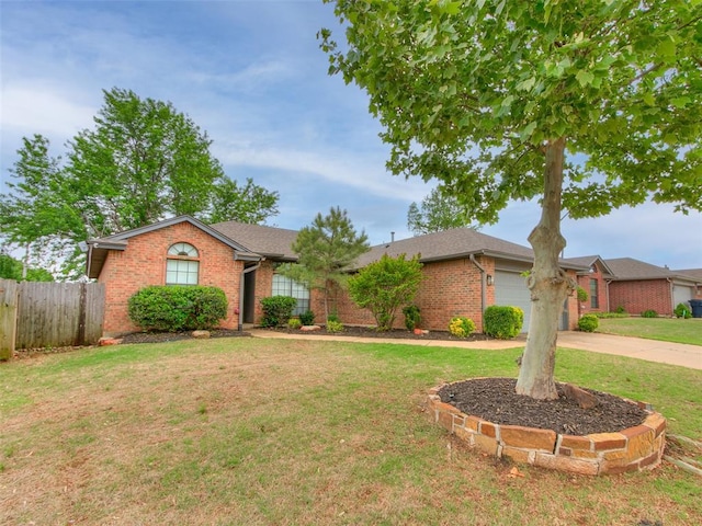 ranch-style home featuring driveway, a front yard, a garage, brick siding, and fence