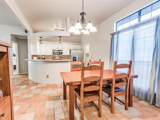 dining room featuring a notable chandelier