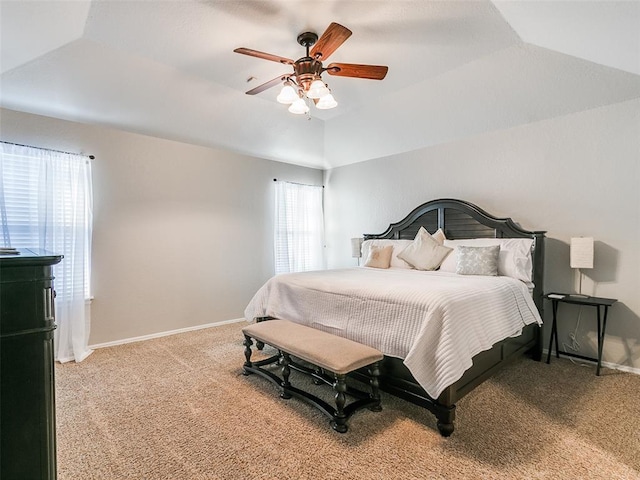 bedroom featuring a ceiling fan, baseboards, light colored carpet, and lofted ceiling