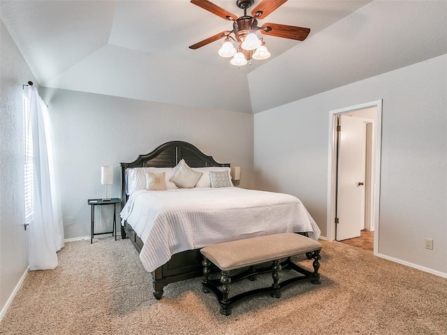 bedroom with carpet floors, a ceiling fan, baseboards, and vaulted ceiling