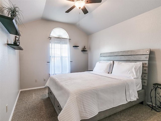 bedroom with baseboards, lofted ceiling, ceiling fan, and carpet