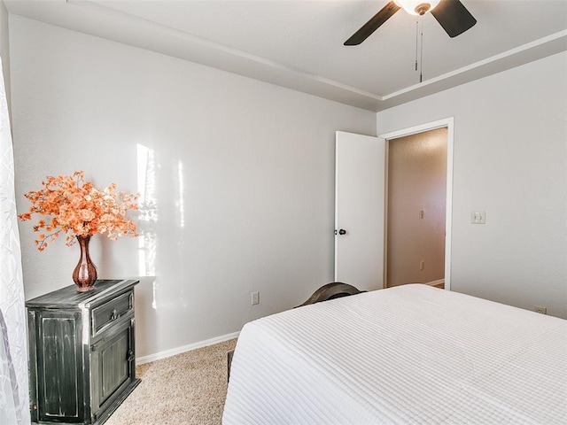 bedroom with baseboards, carpet, and ceiling fan