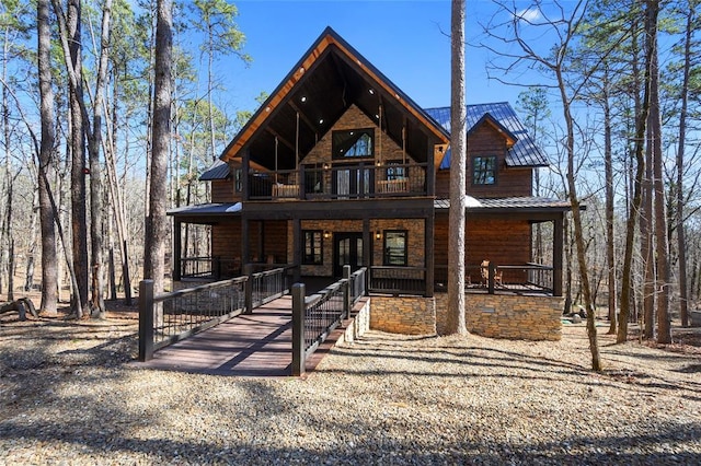 rustic home with a porch and metal roof