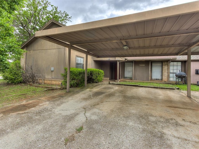 3800 Southwind Ct, Oklahoma City, OK 73179 - view of parking / parking lot with a carport