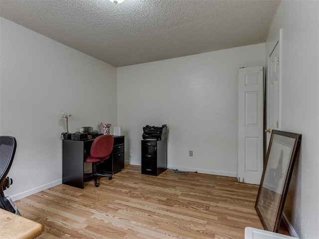 3800 Southwind Ct, Oklahoma City, OK 73179 - home office featuring light wood-style floors and a textured ceiling