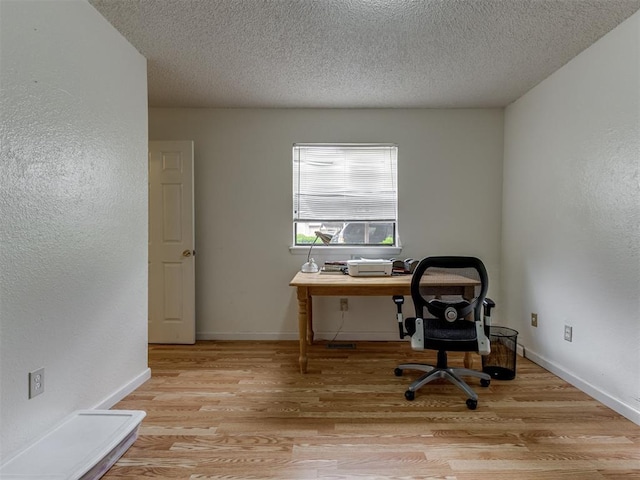 3800 Southwind Ct, Oklahoma City, OK 73179 - office area featuring light wood-style floors and a textured ceiling