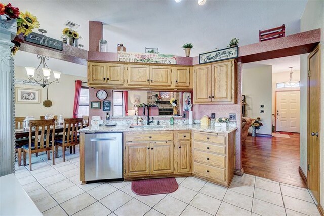 7904 NW 81st St, Oklahoma City, OK 73132 - kitchen featuring light tile patterned floors, a sink, plenty of natural light, dishwasher, and a notable chandelier