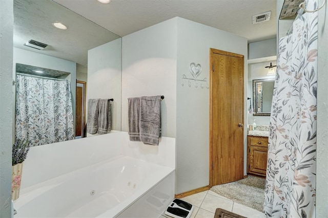 7904 NW 81st St, Oklahoma City, OK 73132 - full bath featuring visible vents, a whirlpool tub, recessed lighting, tile patterned floors, and vanity